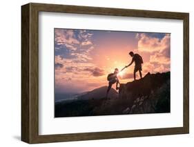 People Helping Each Other Hike up a Mountain at Sunrise. Giving a Helping Hand, and Active Fit Life-null-Framed Photographic Print