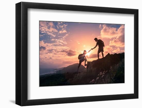 People Helping Each Other Hike up a Mountain at Sunrise. Giving a Helping Hand, and Active Fit Life-null-Framed Photographic Print
