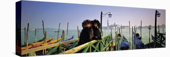 People in carnival costume at dock, Venice, Veneto, Italy-null-Stretched Canvas