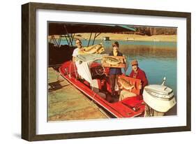 People in Motor Boat Holding Plaques with Fish-null-Framed Art Print