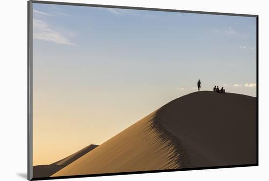 People in silhouette on Khongor sand dunes in Gobi Gurvan Saikhan National Park, Sevrei district, S-Francesco Vaninetti-Mounted Photographic Print