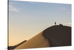 People in silhouette on Khongor sand dunes in Gobi Gurvan Saikhan National Park, Sevrei district, S-Francesco Vaninetti-Stretched Canvas