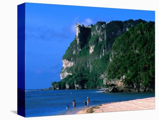 People in Water at Tumon Beach with Amantes (Two Lovers) Point Behind, Tumon, Guam-John Elk III-Stretched Canvas