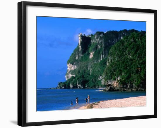 People in Water at Tumon Beach with Amantes (Two Lovers) Point Behind, Tumon, Guam-John Elk III-Framed Photographic Print