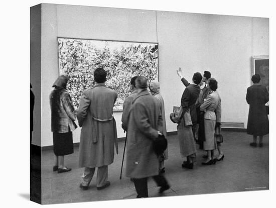 People Looking at a Painting by Artist Jackson Pollack at an American Art Show-Frank Scherschel-Stretched Canvas