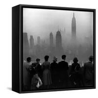 People on Top of a Building Looking Down Into Downtown Misty Smog covering Empire state Building-Eliot Elisofon-Framed Stretched Canvas