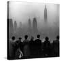 People on Top of a Building Looking Down Into Downtown Misty Smog covering Empire state Building-Eliot Elisofon-Stretched Canvas