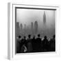 People on Top of a Building Looking Down Into Downtown Misty Smog covering Empire state Building-Eliot Elisofon-Framed Photographic Print