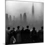 People on Top of a Building Looking Down Into Downtown Misty Smog covering Empire state Building-Eliot Elisofon-Mounted Photographic Print