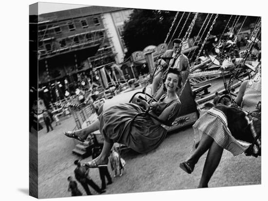 People Riding a Merry Go Round, During the Celebration of Munich's 800th Anniversary-Michael Rougier-Stretched Canvas