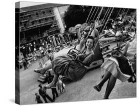 People Riding a Merry Go Round, During the Celebration of Munich's 800th Anniversary-Michael Rougier-Stretched Canvas