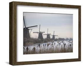 People Skate on Frozen Canals in Kinderdijk's Mill Area, a UNESCO World Heritage Site, Netherlands-null-Framed Photographic Print