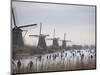 People Skate on Frozen Canals in Kinderdijk's Mill Area, a UNESCO World Heritage Site, Netherlands-null-Mounted Photographic Print