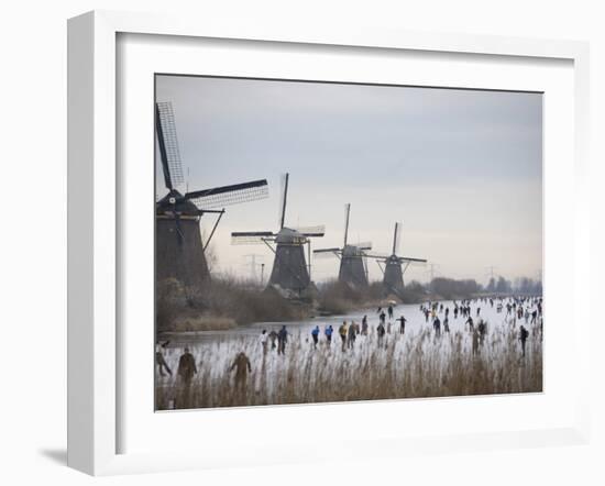 People Skate on Frozen Canals in Kinderdijk's Mill Area, a UNESCO World Heritage Site, Netherlands-null-Framed Photographic Print