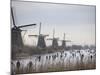 People Skate on Frozen Canals in Kinderdijk's Mill Area, a UNESCO World Heritage Site, Netherlands-null-Mounted Photographic Print