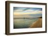 People standing on a sandbar in the water watching sunset-Sheila Haddad-Framed Photographic Print