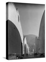 People Walking Between Sound Stages at Warner Bros. Studio-Margaret Bourke-White-Stretched Canvas