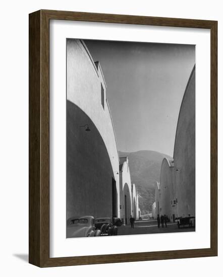 People Walking Between Sound Stages at Warner Bros. Studio-Margaret Bourke-White-Framed Photographic Print