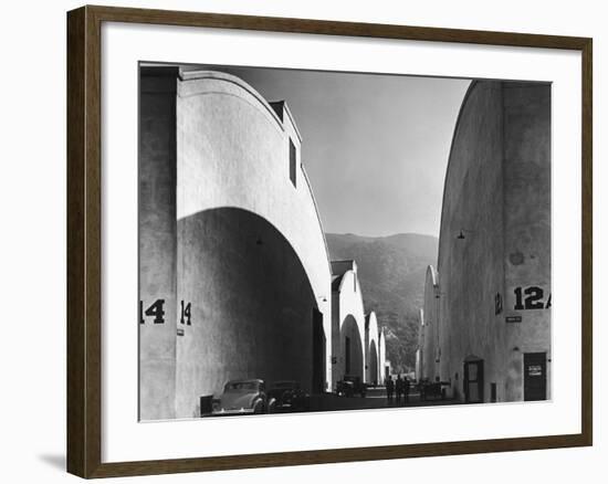 People Walking Between Sound Stages at Warner Brothers Studio-Margaret Bourke-White-Framed Photographic Print