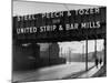 People Walking under Large Sign at Peech and Tozer Steel Plant-null-Mounted Photographic Print