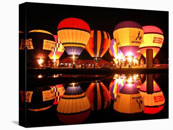 People Watch Hot Air Balloons as They Reflect off the Barigui Lake-null-Stretched Canvas