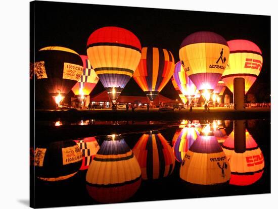 People Watch Hot Air Balloons as They Reflect off the Barigui Lake-null-Stretched Canvas