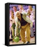 People Watching a Senior Man Bowling at a Bowling Alley-null-Framed Stretched Canvas