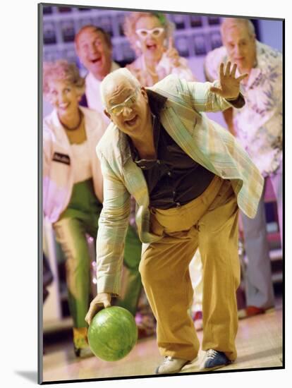 People Watching a Senior Man Bowling at a Bowling Alley-null-Mounted Photographic Print