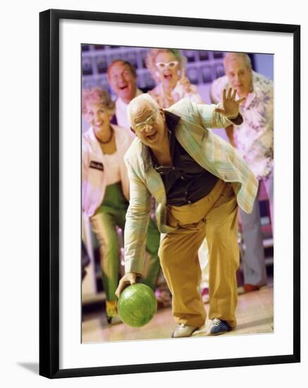 People Watching a Senior Man Bowling at a Bowling Alley-null-Framed Photographic Print
