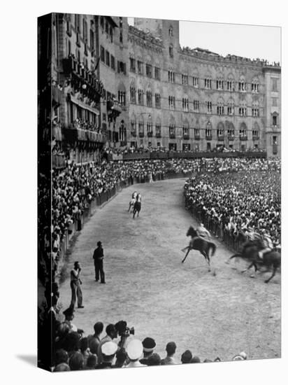 People Watching Horse Race that Is Traditional Part of the Palio Celebration-Walter Sanders-Stretched Canvas