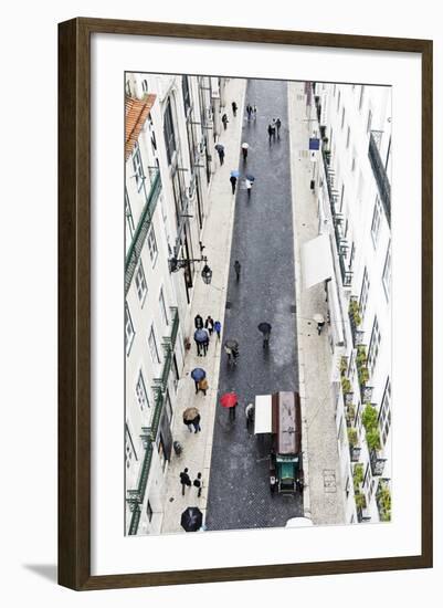 People with Colourful Umbrellas, Vertical View from the Elevador De Santa Justa, Lisbon-Axel Schmies-Framed Photographic Print