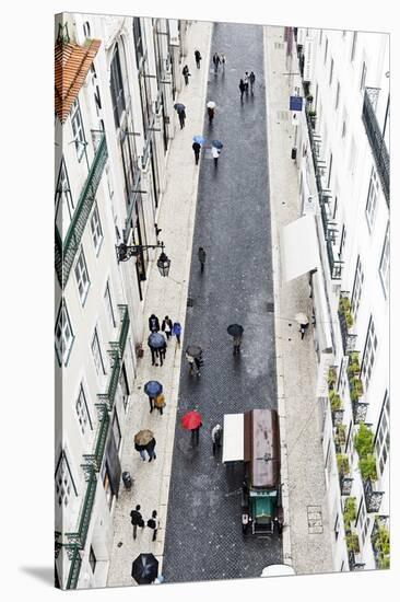 People with Colourful Umbrellas, Vertical View from the Elevador De Santa Justa, Lisbon-Axel Schmies-Stretched Canvas