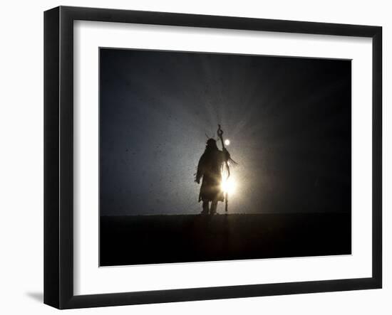 Performer is Silhouetted at the Opening Ceremonies for the XXI Olympic Winter Games in Vancouver-null-Framed Premium Photographic Print