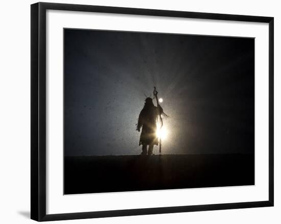 Performer is Silhouetted at the Opening Ceremonies for the XXI Olympic Winter Games in Vancouver-null-Framed Premium Photographic Print