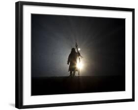 Performer is Silhouetted at the Opening Ceremonies for the XXI Olympic Winter Games in Vancouver-null-Framed Photographic Print