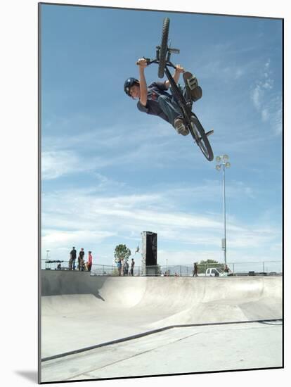 Performing a Bicycle Stunt-null-Mounted Premium Photographic Print