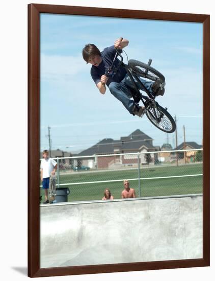 Performing a Bicycle Stunt-null-Framed Photographic Print