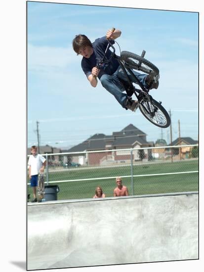 Performing a Bicycle Stunt-null-Mounted Photographic Print