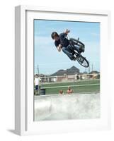 Performing a Bicycle Stunt-null-Framed Photographic Print