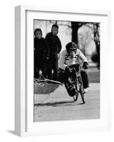 Performing Chimpanzee Zippy Riding a Bike-null-Framed Photographic Print