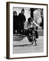 Performing Chimpanzee Zippy Riding a Bike-null-Framed Photographic Print