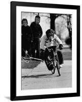 Performing Chimpanzee Zippy Riding a Bike-null-Framed Photographic Print