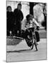 Performing Chimpanzee Zippy Riding a Bike-null-Mounted Photographic Print