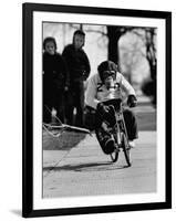 Performing Chimpanzee Zippy Riding a Bike-null-Framed Photographic Print