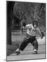 Performing Chimpanzee Zippy Riding on Skates-null-Mounted Premium Photographic Print