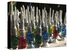 Perfume Bottles, the Souqs of Marrakech, Marrakech, Morocco-Walter Bibikow-Stretched Canvas