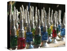 Perfume Bottles, the Souqs of Marrakech, Marrakech, Morocco-Walter Bibikow-Stretched Canvas