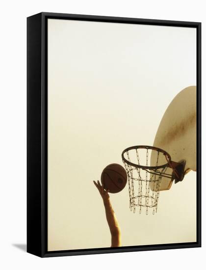 Person's Hand Holding a Basketball Near the Hoop-null-Framed Stretched Canvas