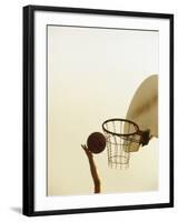 Person's Hand Holding a Basketball Near the Hoop-null-Framed Photographic Print