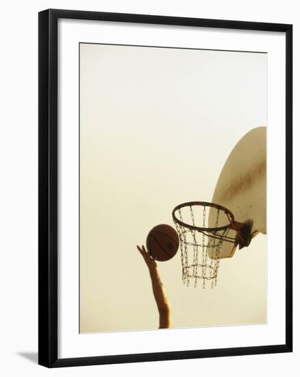 Person's Hand Holding a Basketball Near the Hoop-null-Framed Photographic Print